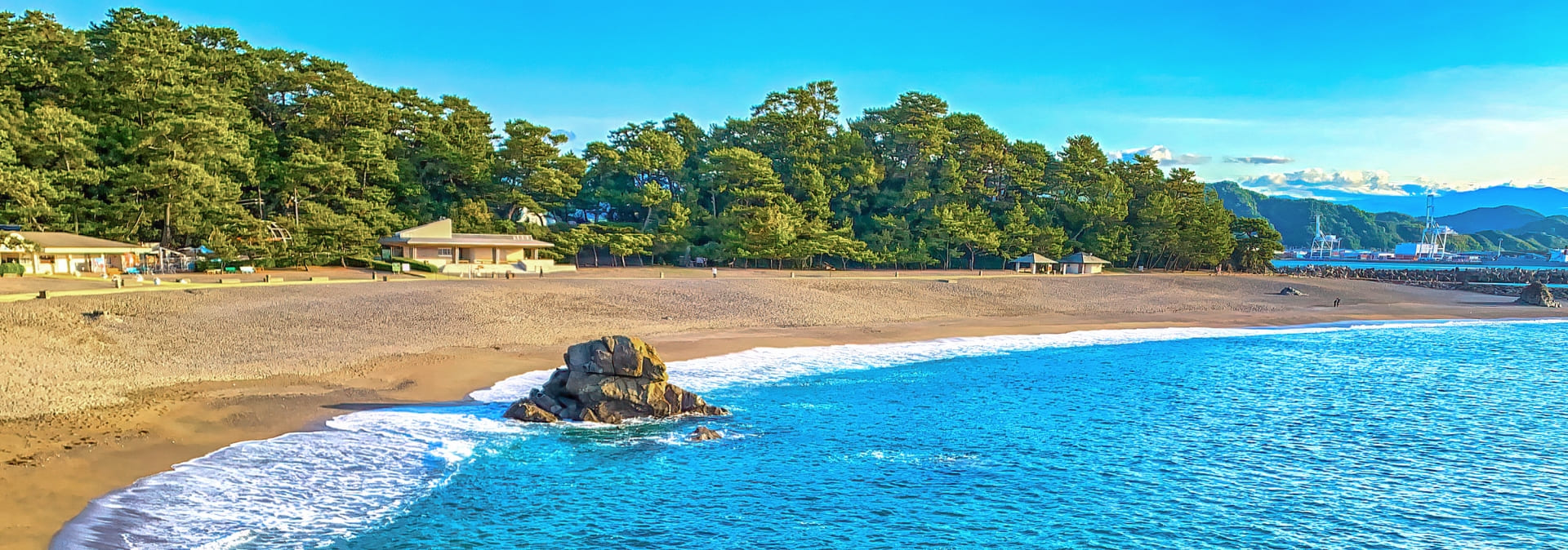 Rocky Pacific coastline with ocean waves crashing on the shore